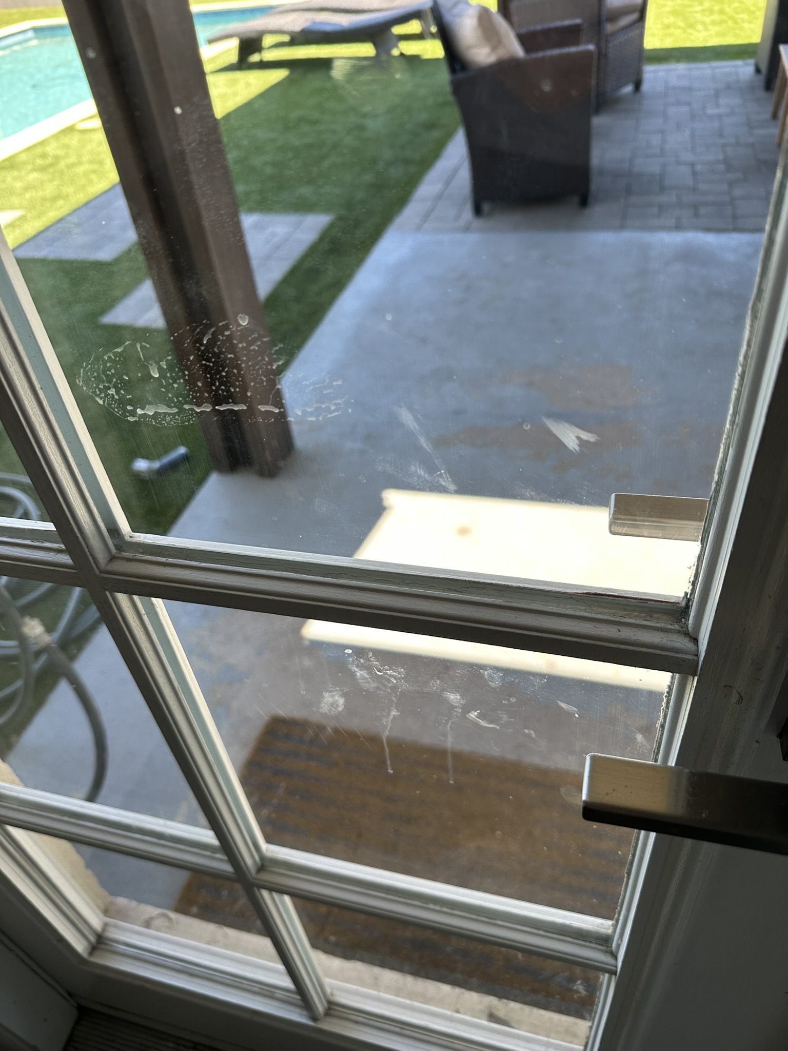 Door glass before STR cleaning with smudges