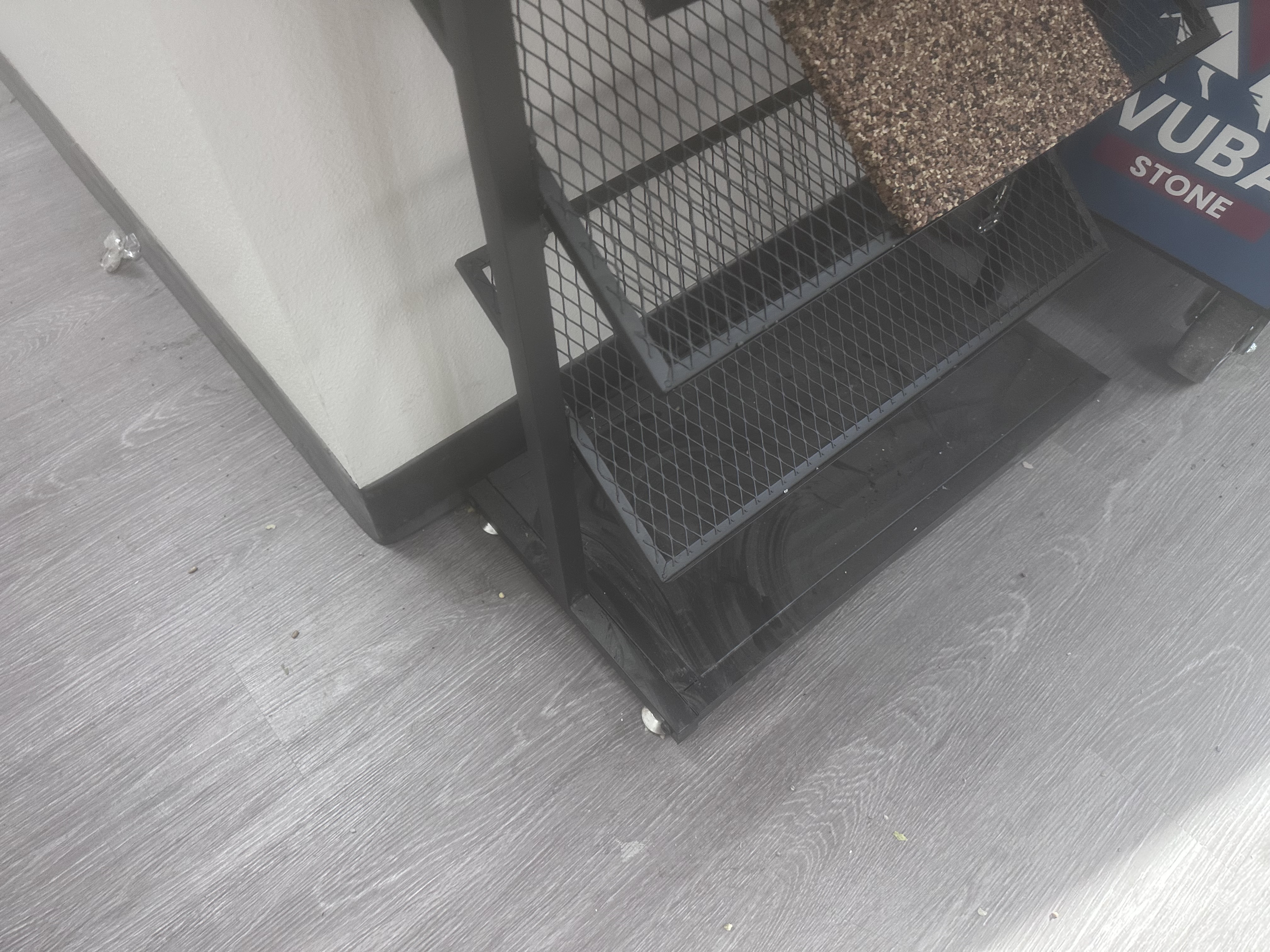 Dust and debris along an office floor edge before commercial cleaning in Phoenix