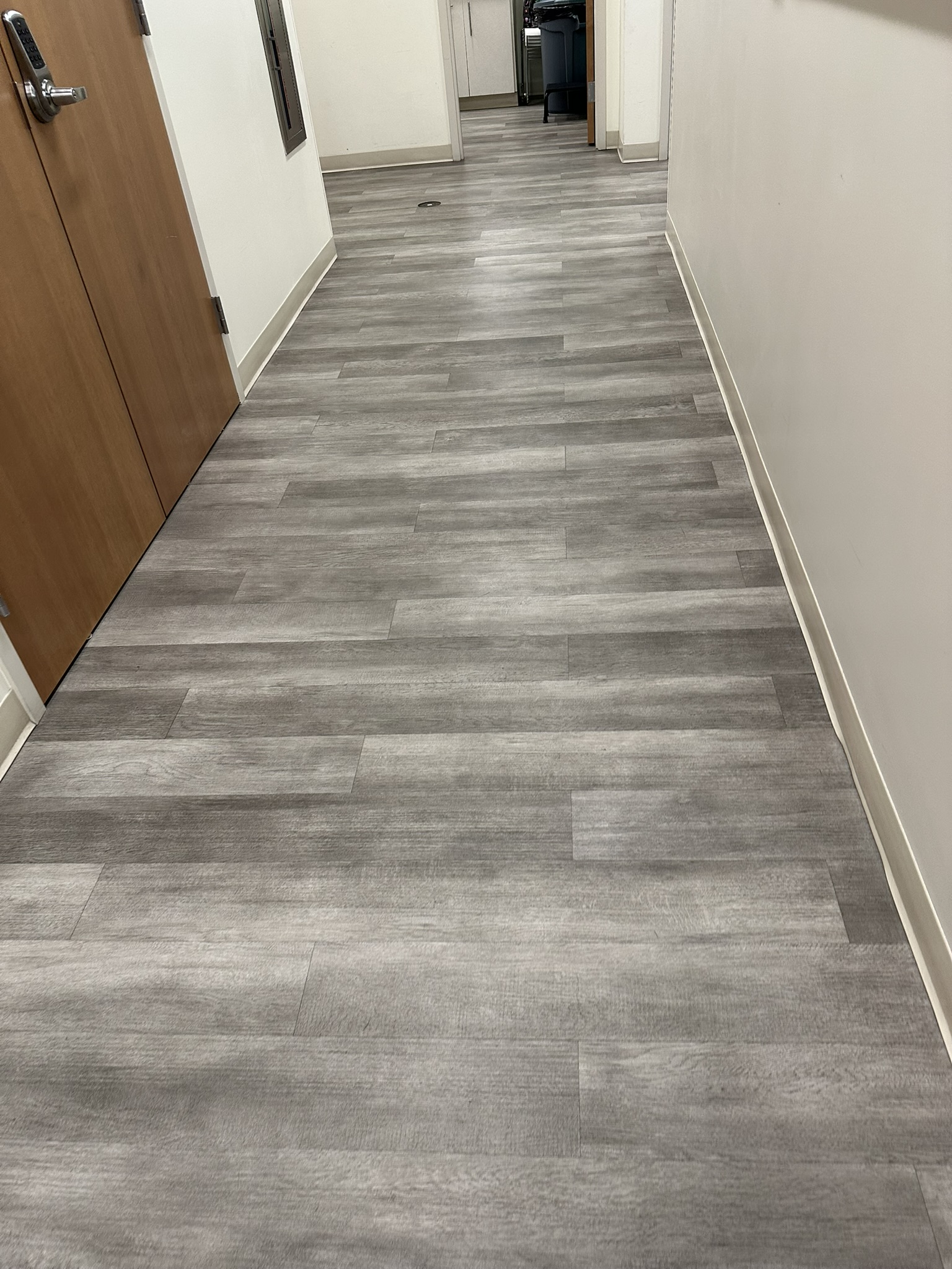 Resilient flooring in medical clinic corridor