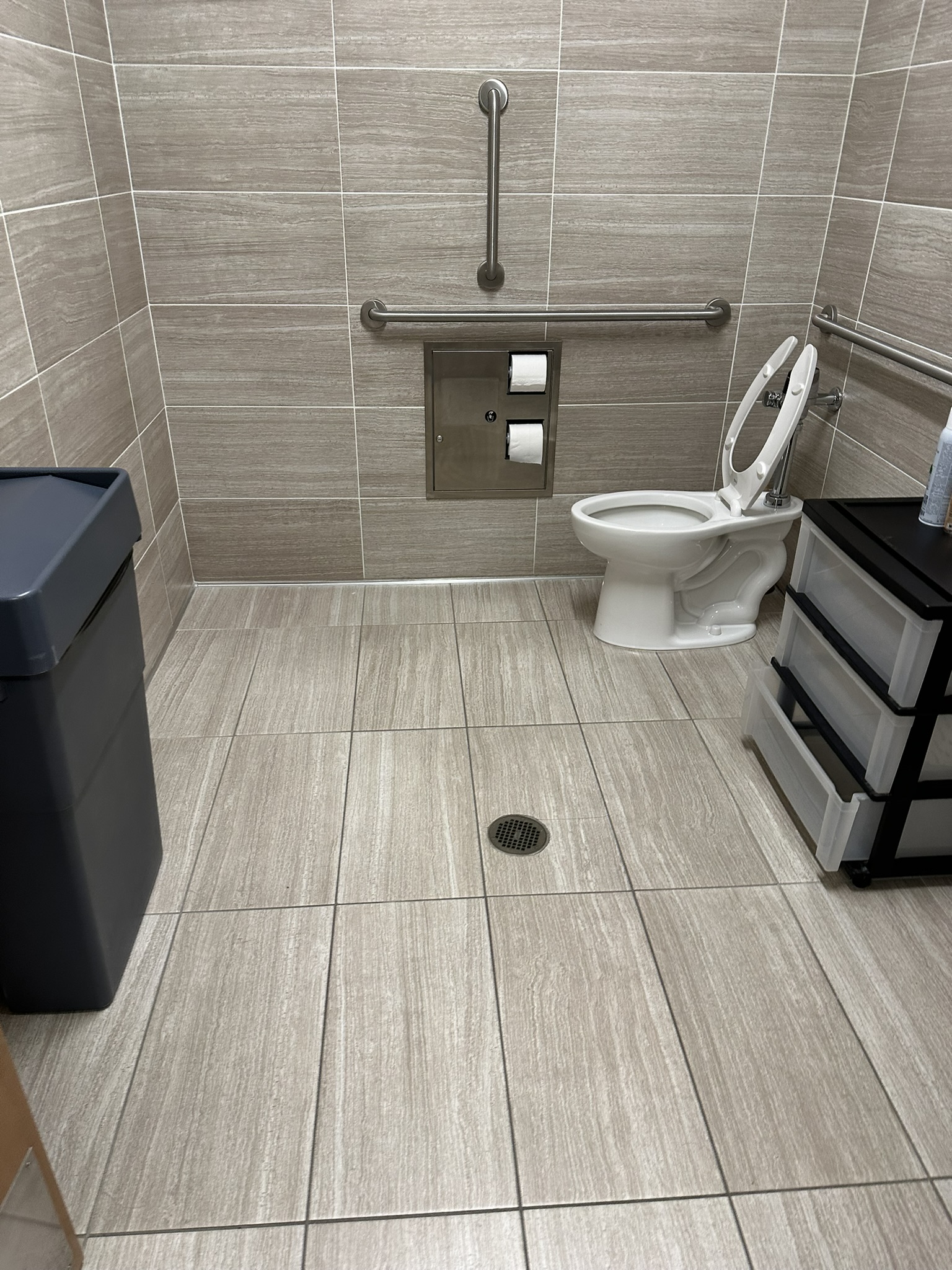 Medical clinic restroom floor and fixtures reviewed during inspection