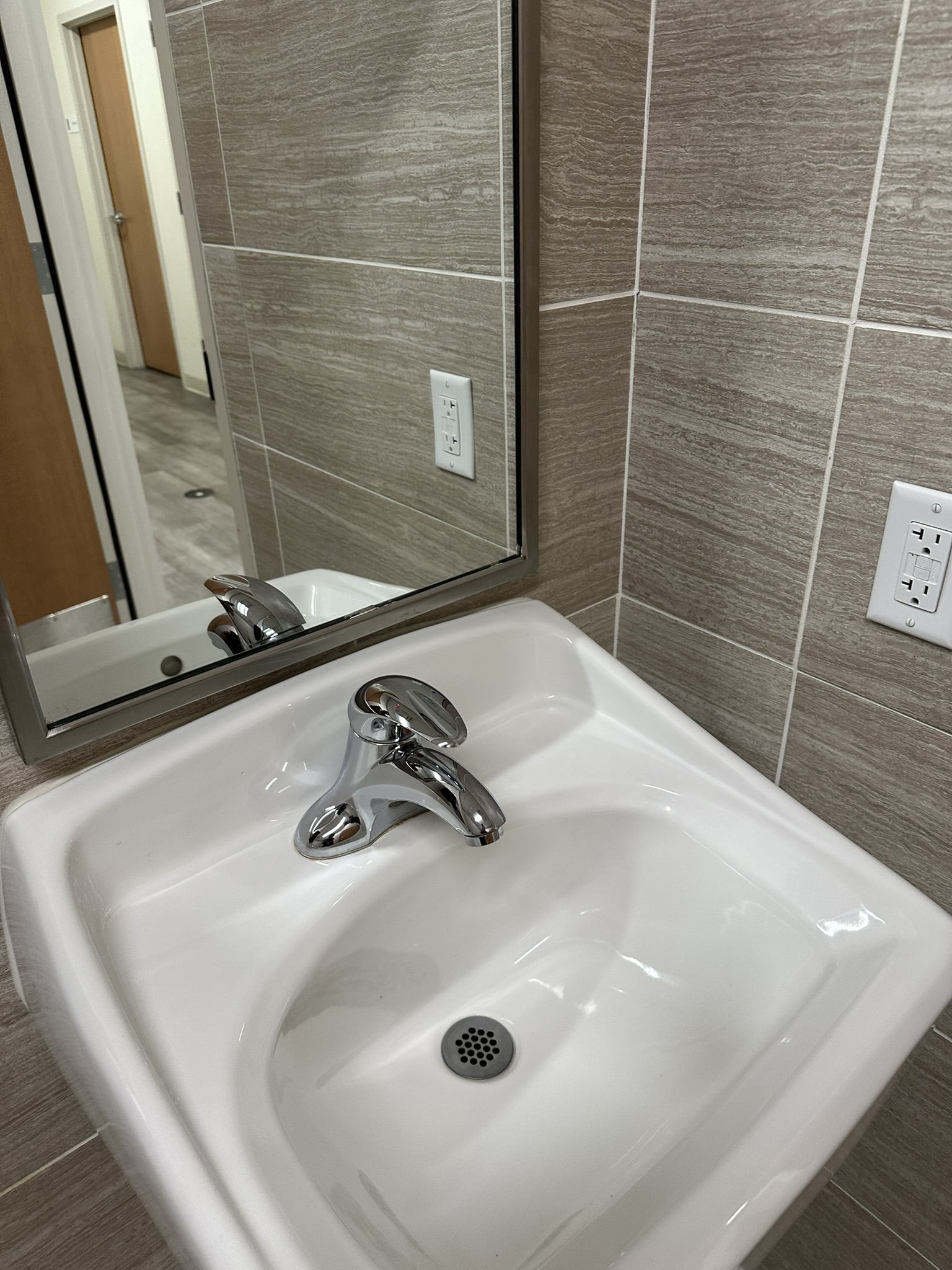 Restroom sink and counter inspected for cleaning requirements