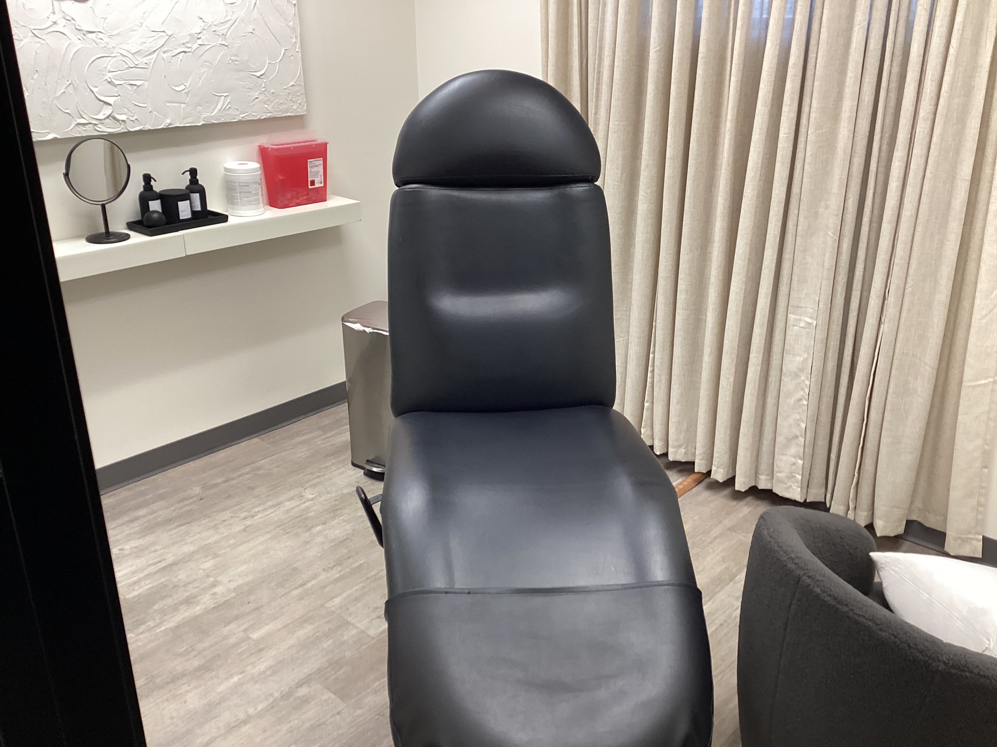 Medical aesthetic treatment room prepared for monthly cleaning