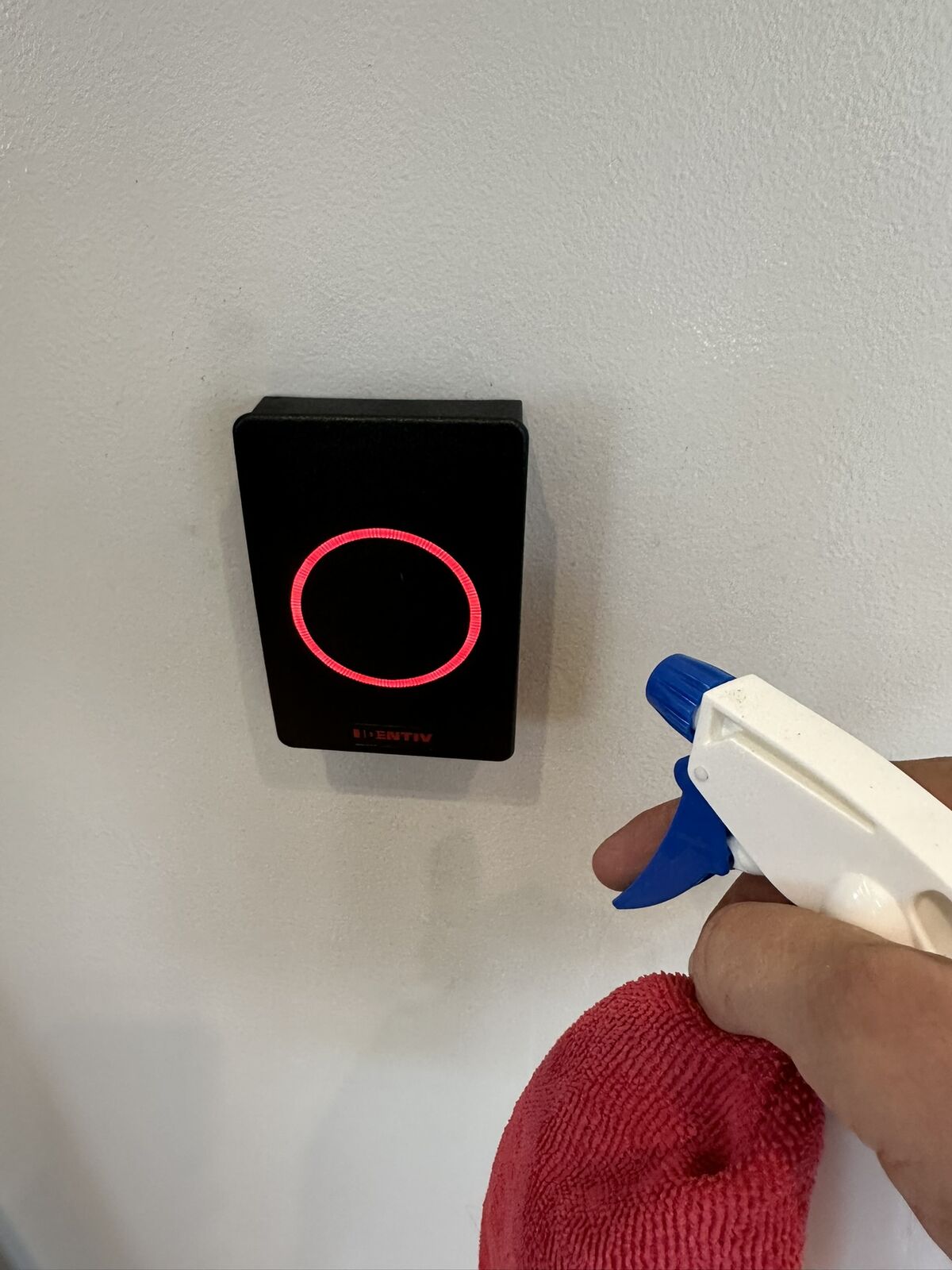 Wall-mounted warehouse access panel being cleaned
