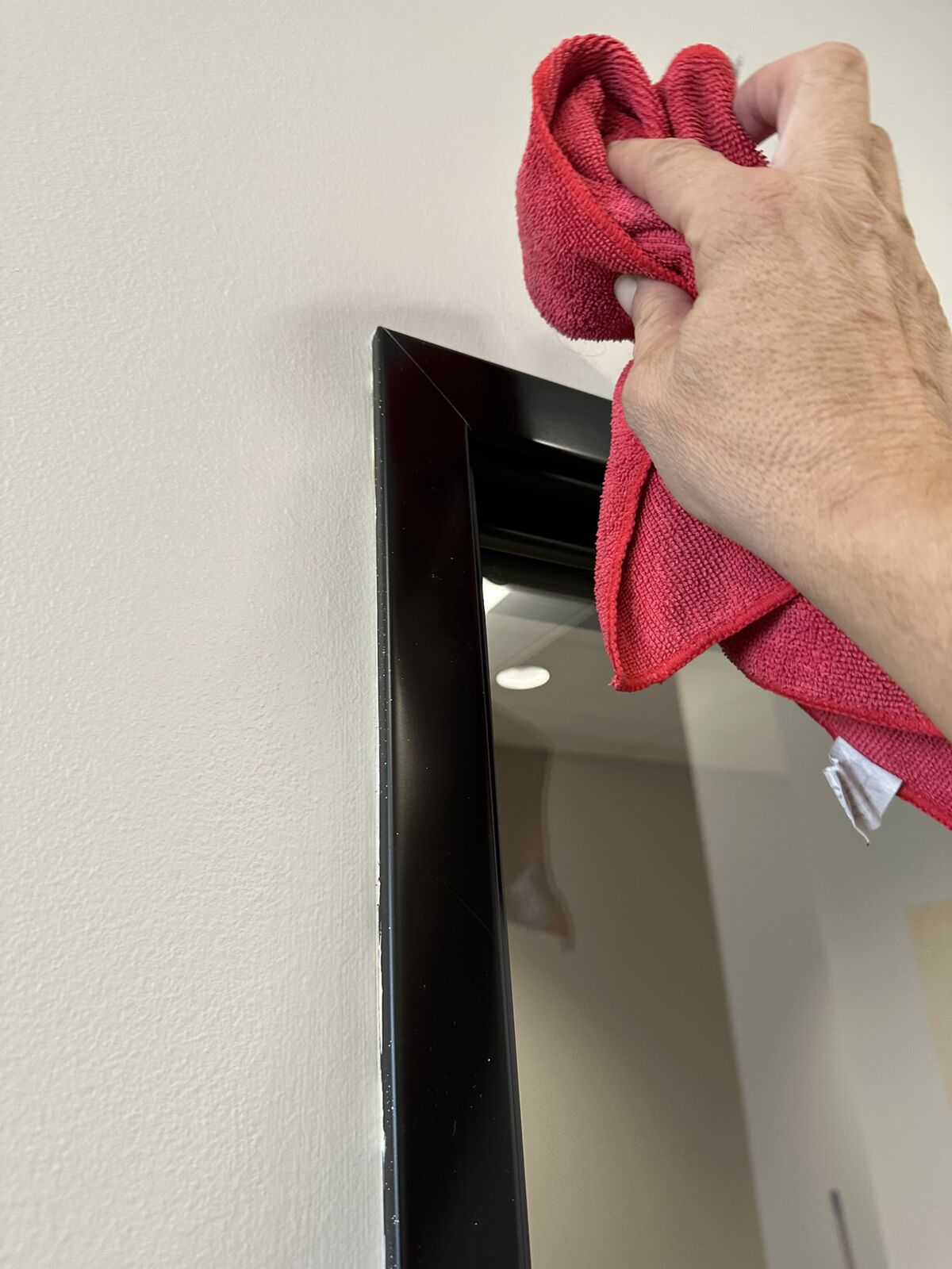 Warehouse door frame being detail cleaned