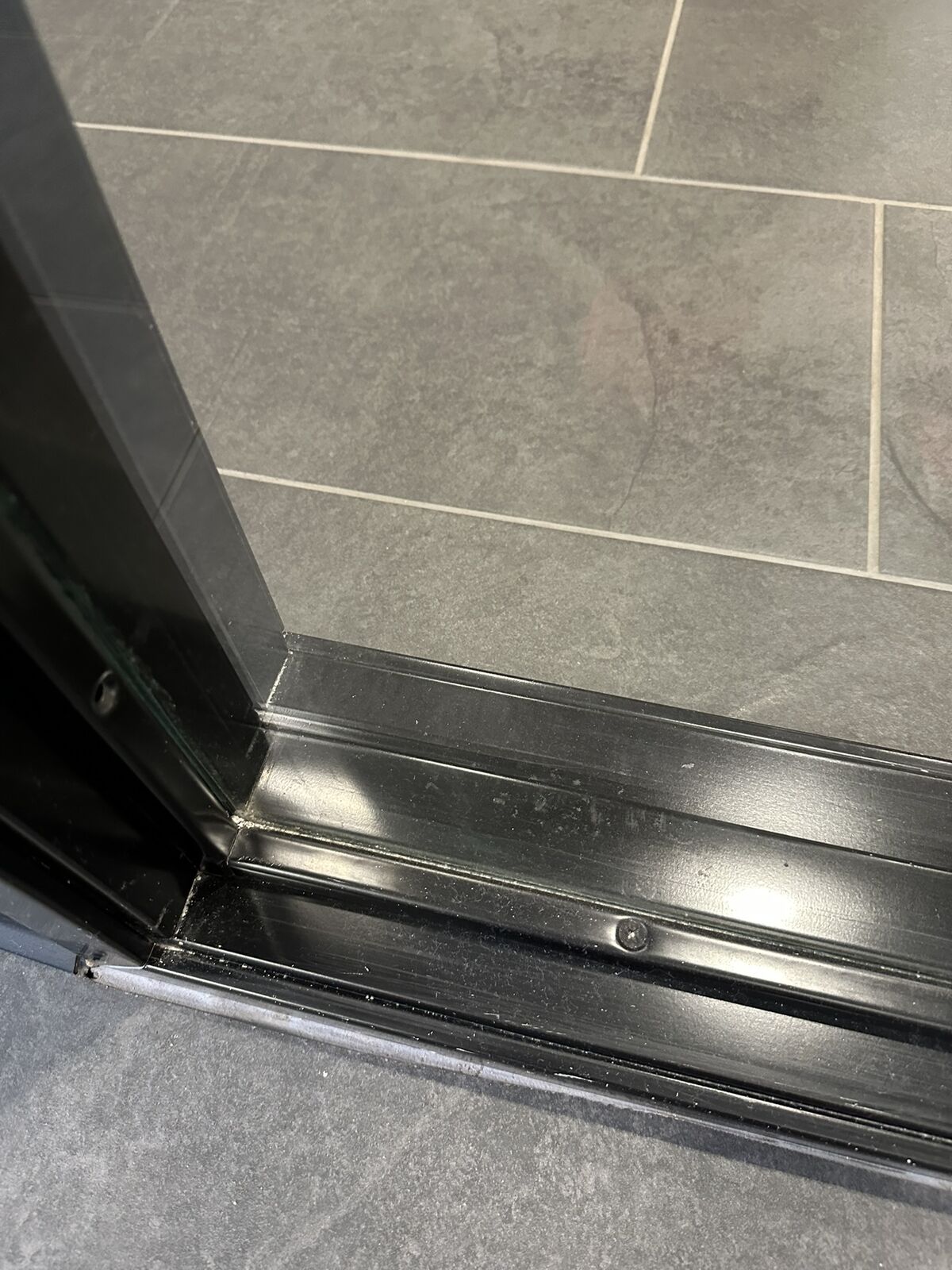 Clean warehouse door threshold after detailing