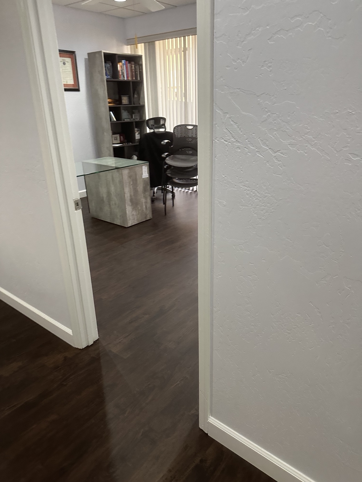 Private office with bookshelf and guest seating in a Tempe Arizona office