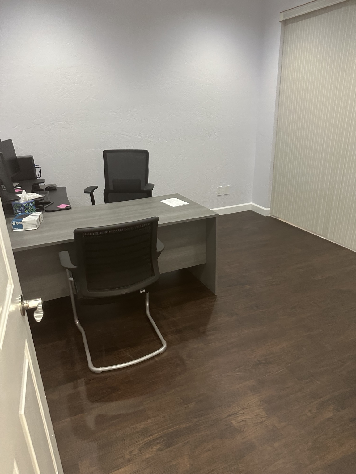 Private office with desk and wood-look flooring in a Tempe Arizona office